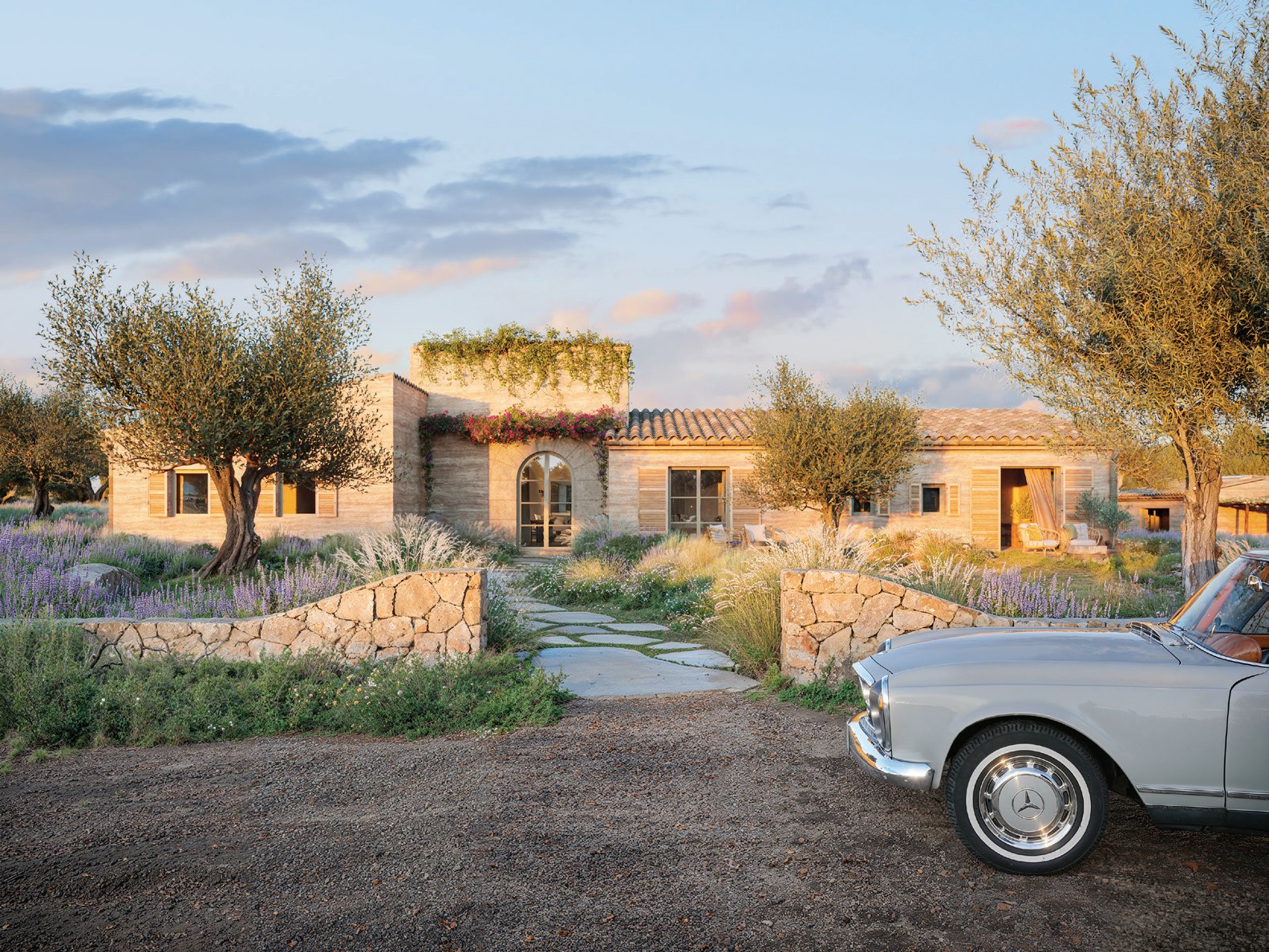 Can Carat main entrance — a modern Mediterranean home framed by gardens